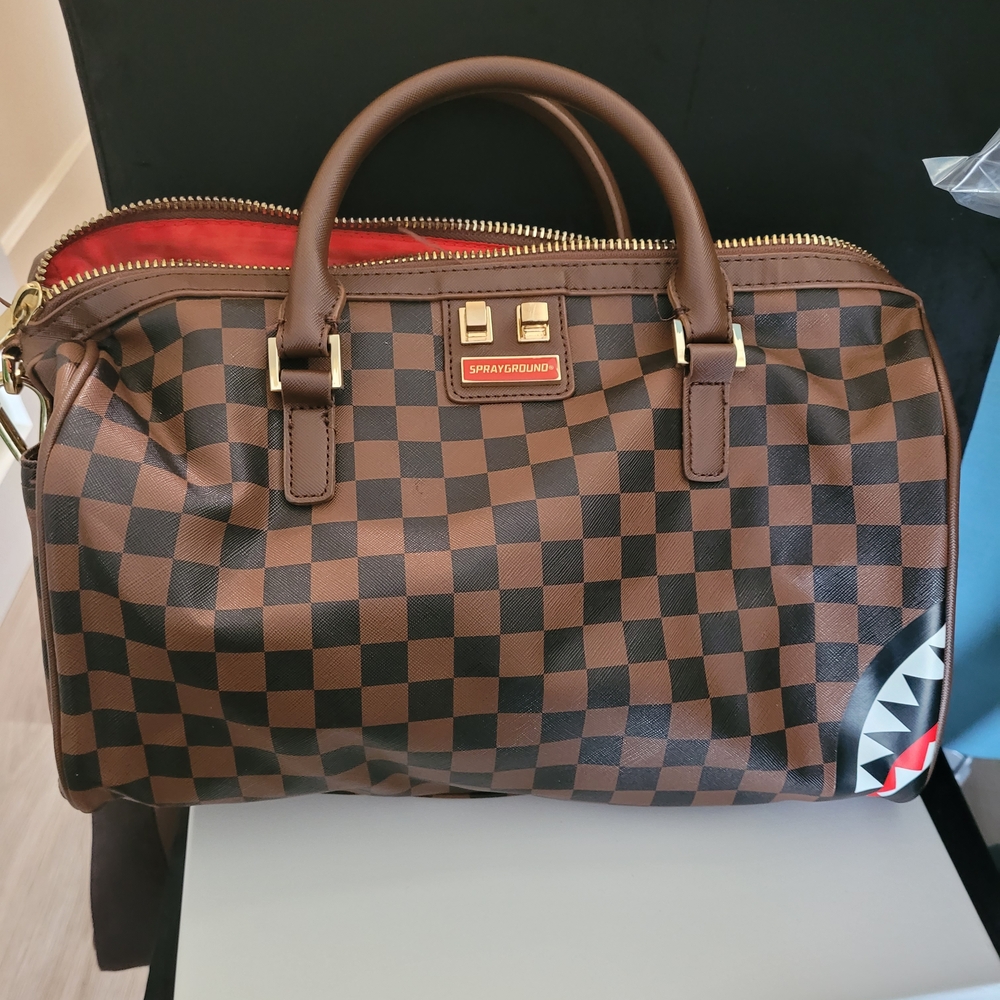 Sprayground Brown Checkered Duffel Bag Great condition just a pen mark inside.